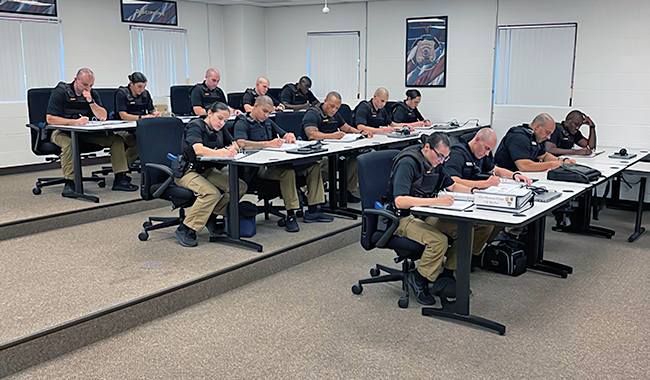Officers in a classroom taking an exam
